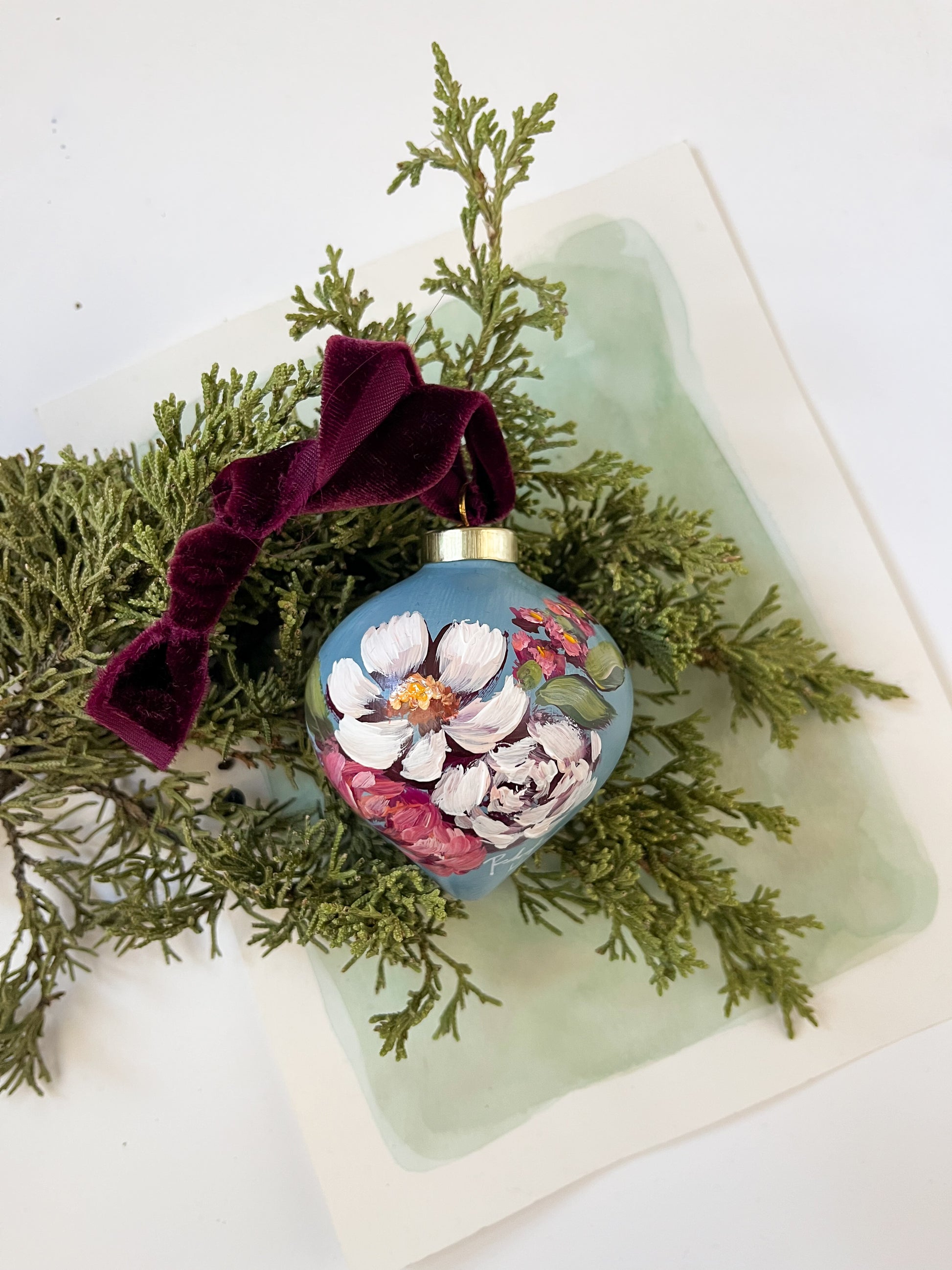 Decorative ornament with floral design on a branch